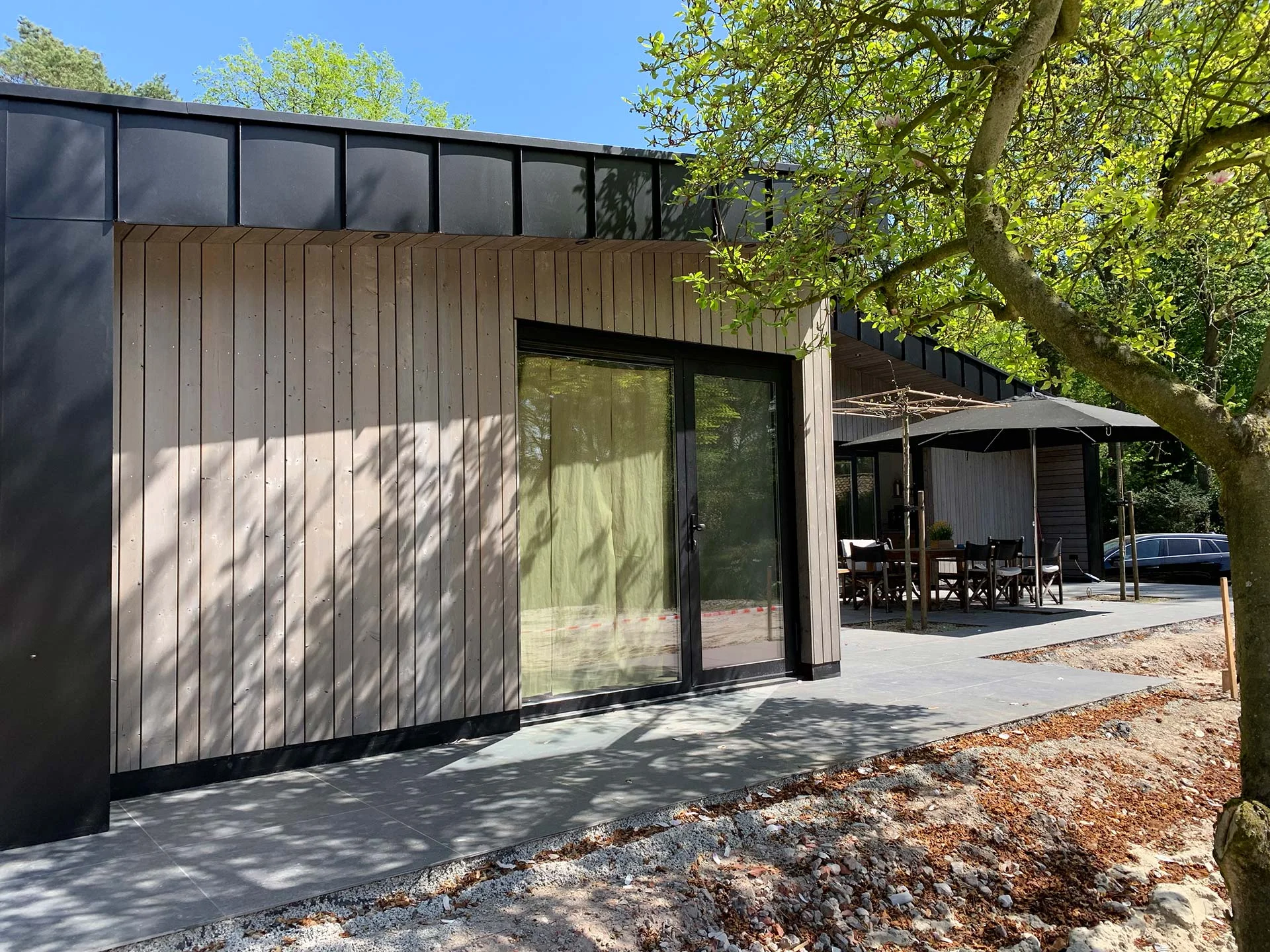 A contemporary SIP home with timber siding and large windows